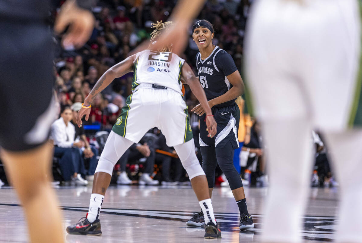 Aces guard Sydney Colson (51) calls a play against Seattle Storm guard Jordan Horston (23) duri ...