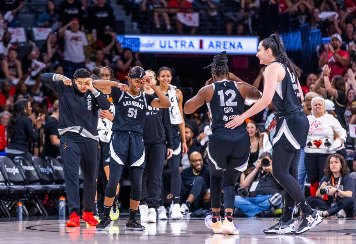 Aces teammates celebrate another great shot by guard Chelsea Gray (12) against the Seattle Stor ...