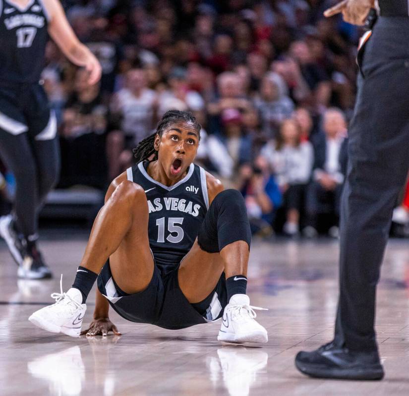 Aces guard Tiffany Hayes (15) is shocked by the lack of a foul call against the Seattle Storm ...