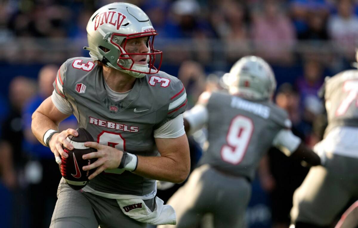 UNLV quarterback Matthew Sluka (3) looks to pass against Kansas in the first half of an NCAA co ...