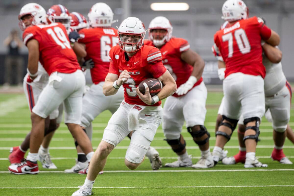 UNLV quarterback Matthew Sluka (3) runs with the ball during the college football game against ...