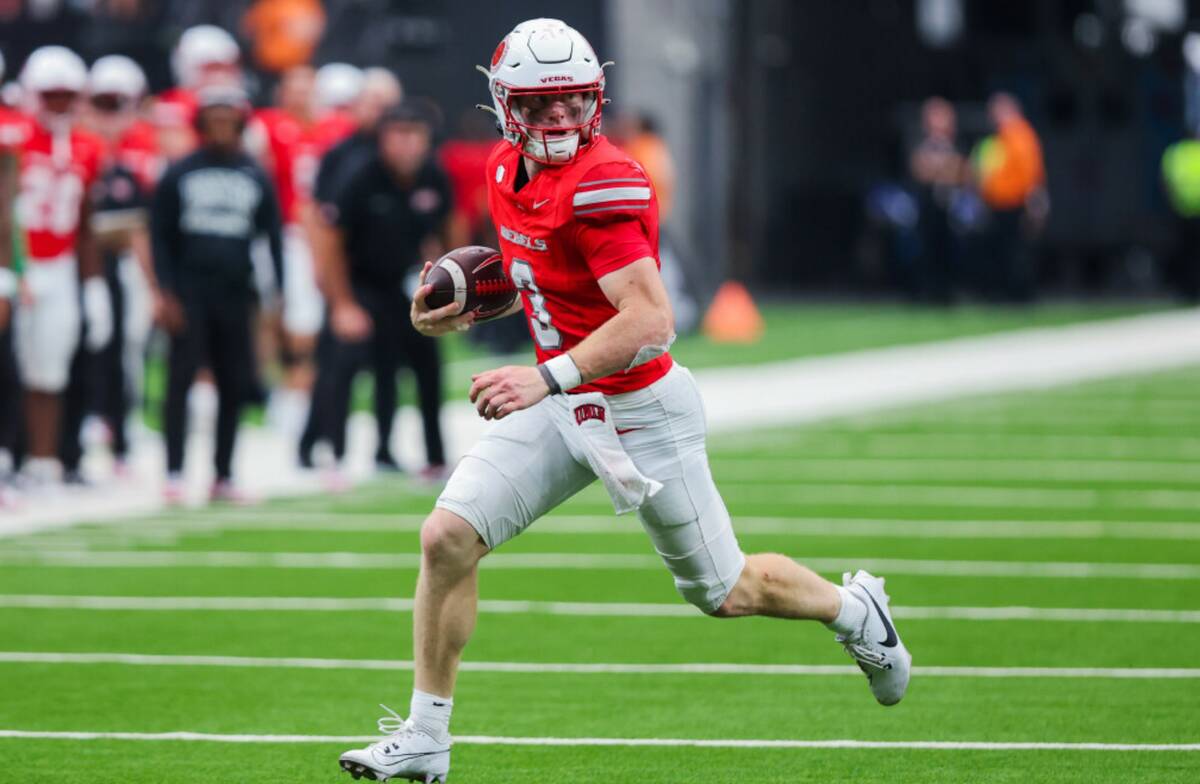 UNLV quarterback Matthew Sluka (3) runs the ball during an NCAA football game between UNLV and ...