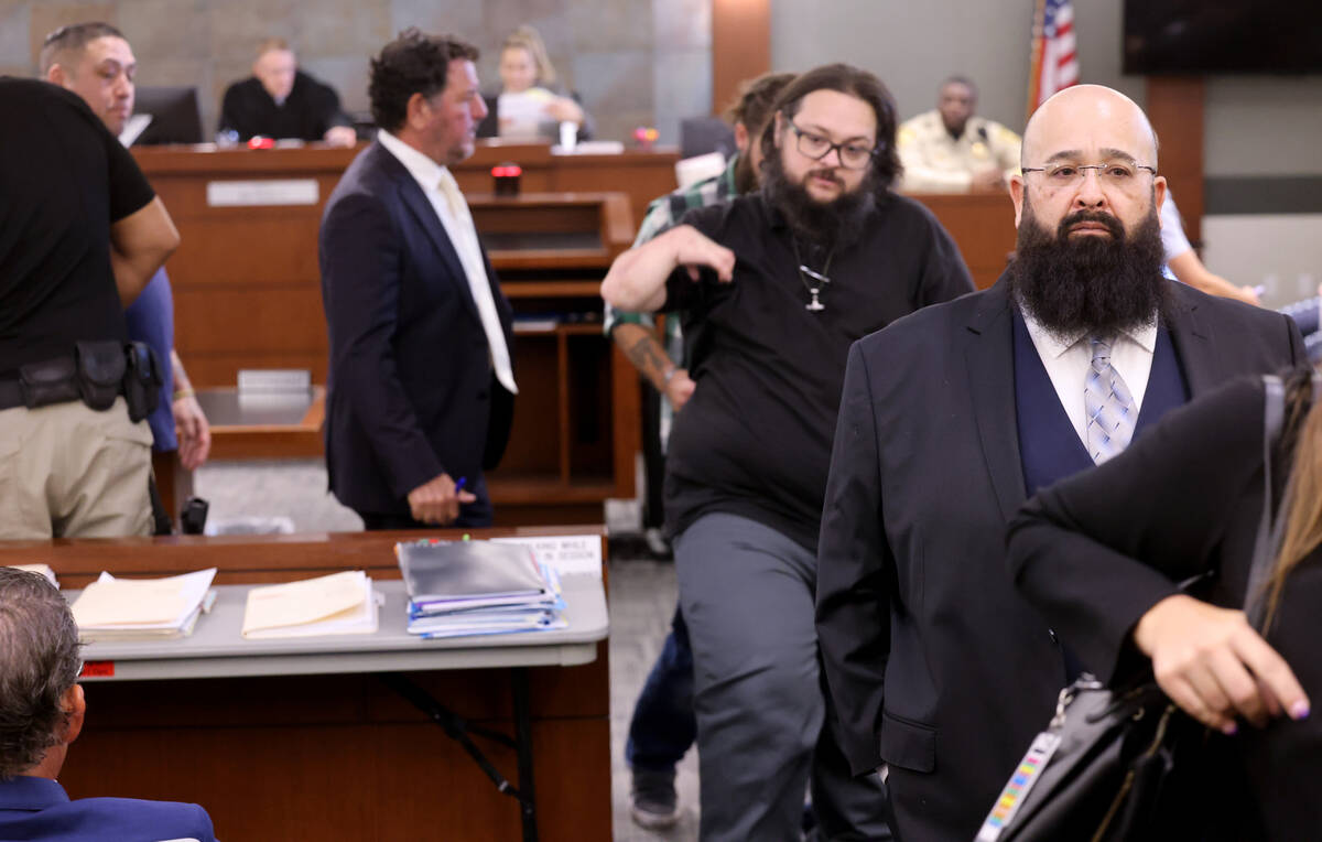 Joshua Rios, right, one of 11 indicted alleged motorcycle gang members, appears in court at the ...