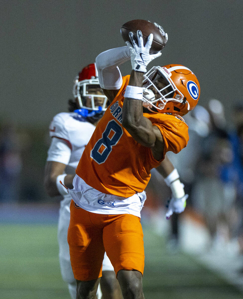 Bishop Gorman wide receiver Greg Toler (8) reaches out to secure a long touchdown pass over Ora ...