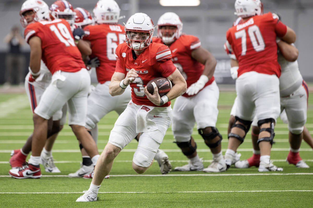 UNLV quarterback Matthew Sluka (3) runs with the ball during the college football game against ...