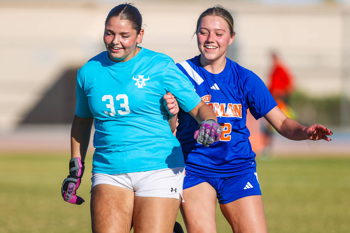 Bishop Gorman forward Grace Allen (22) and Arbor View goalkeeper Emily Rehmel (33) laugh as the ...