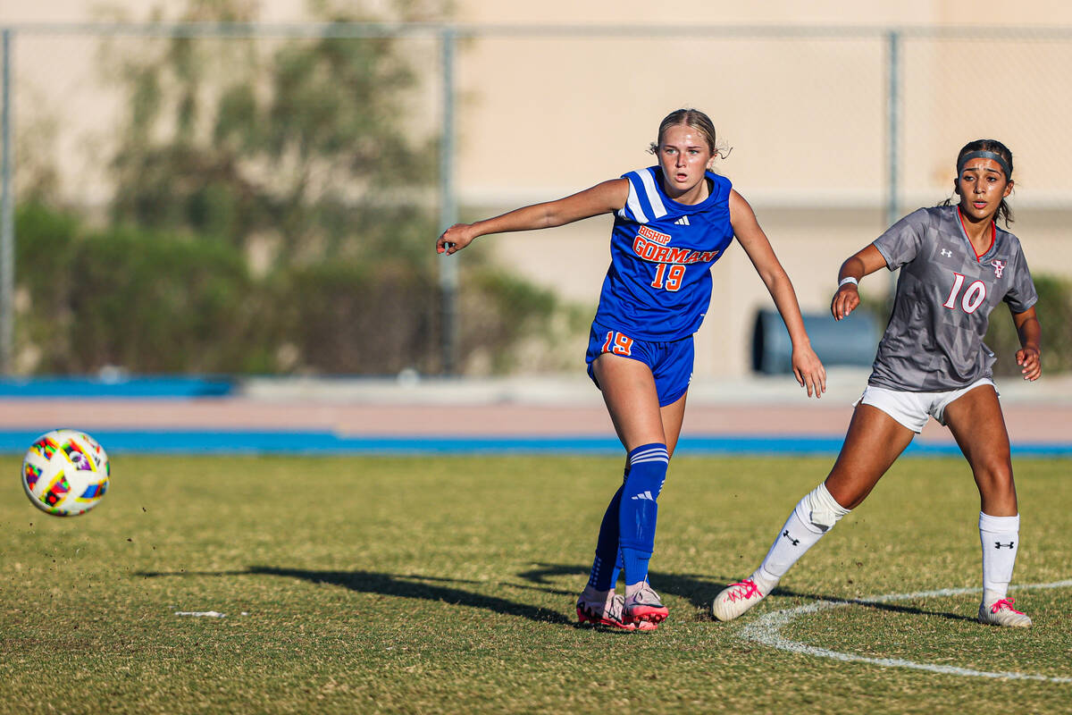 Bishop Gorman defender Melina Duffy (13) and Arbor View’s Natalie Limon (10) eye the bal ...