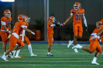 Bishop Gorman cornerback Hayden Stepp (32) celebrates a fumble recovery by Orange Lutheran quar ...