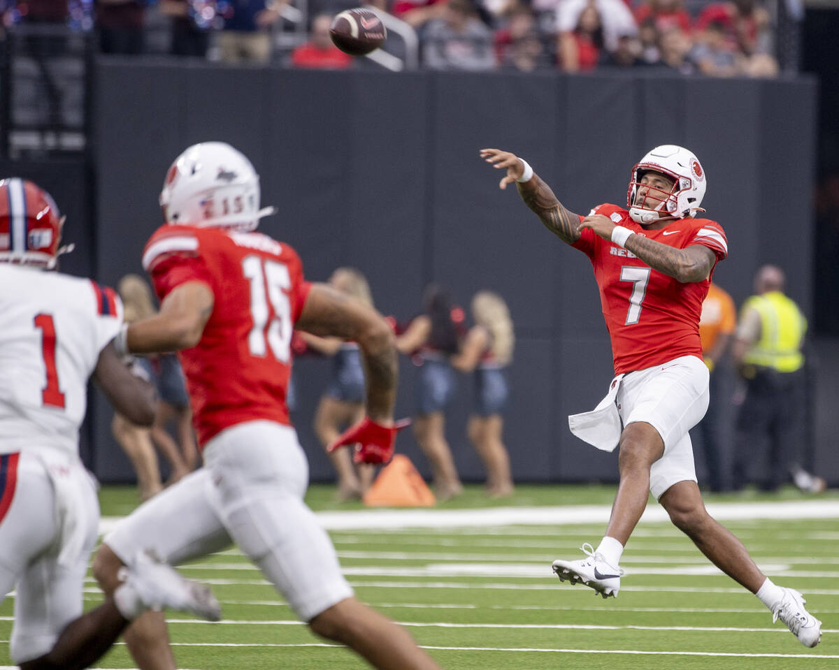 UNLV quarterback Cameron Friel (7) passes the ball while on the run during the college football ...