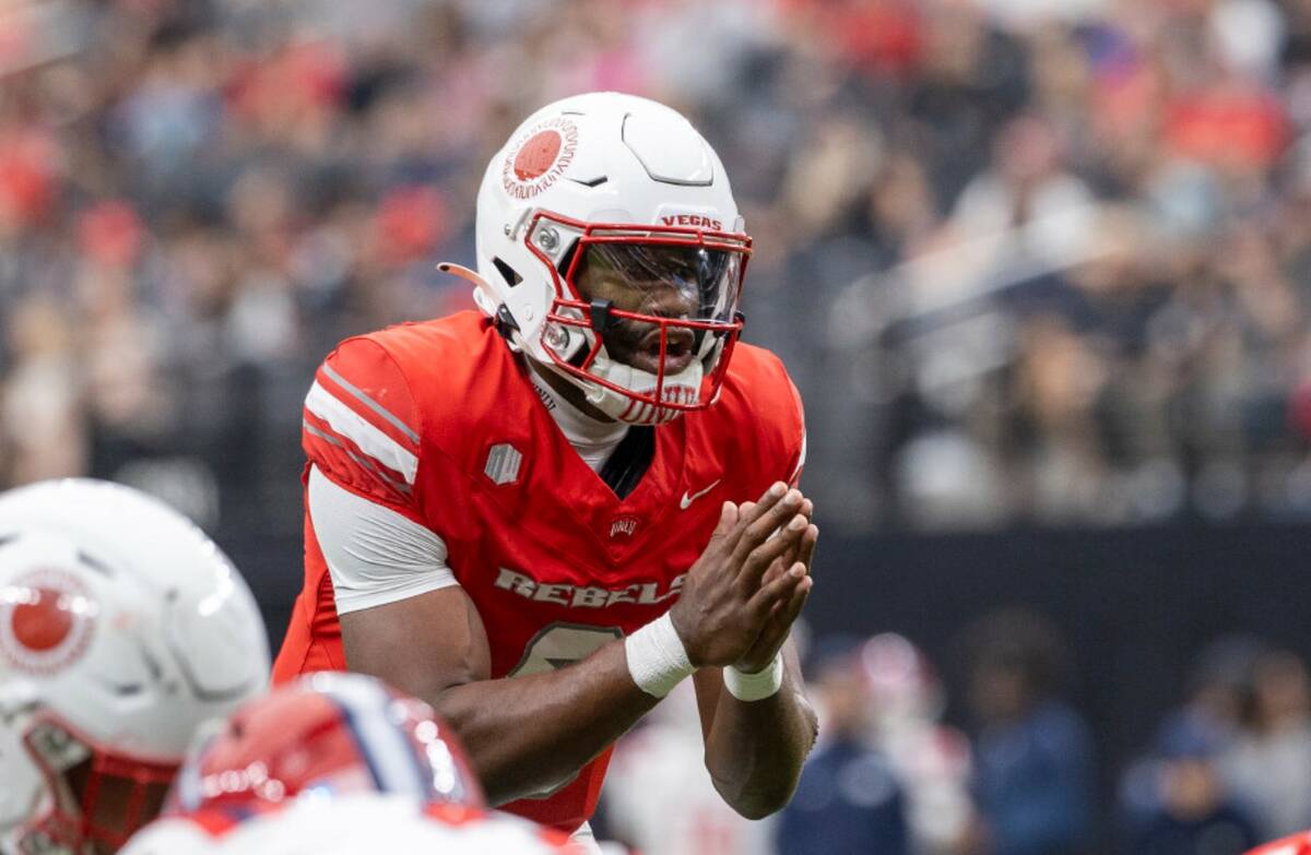 UNLV quarterback Hajj-Malik Williams (6) prepares to snap the ball during the college football ...