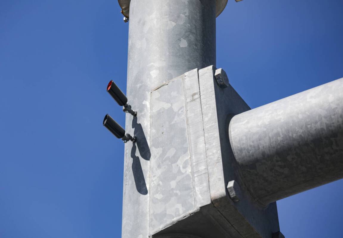 Red light indicators on a street light pole at the intersection of Eastern Avenue and Horizon R ...