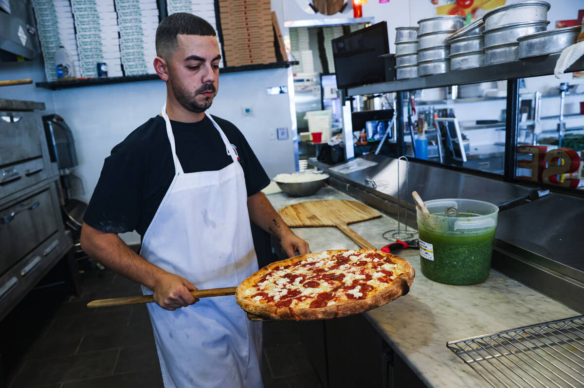 Owner Joey Scolaro prepares the Upside Down Pizza at Lucino’s Pizza in Las Vegas, Thursday, S ...