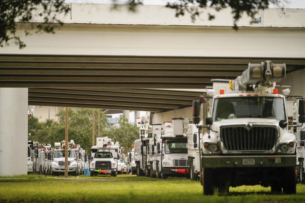 Power crews get ready to restore power lost as Hurricane Helene makes its way toward the Florid ...