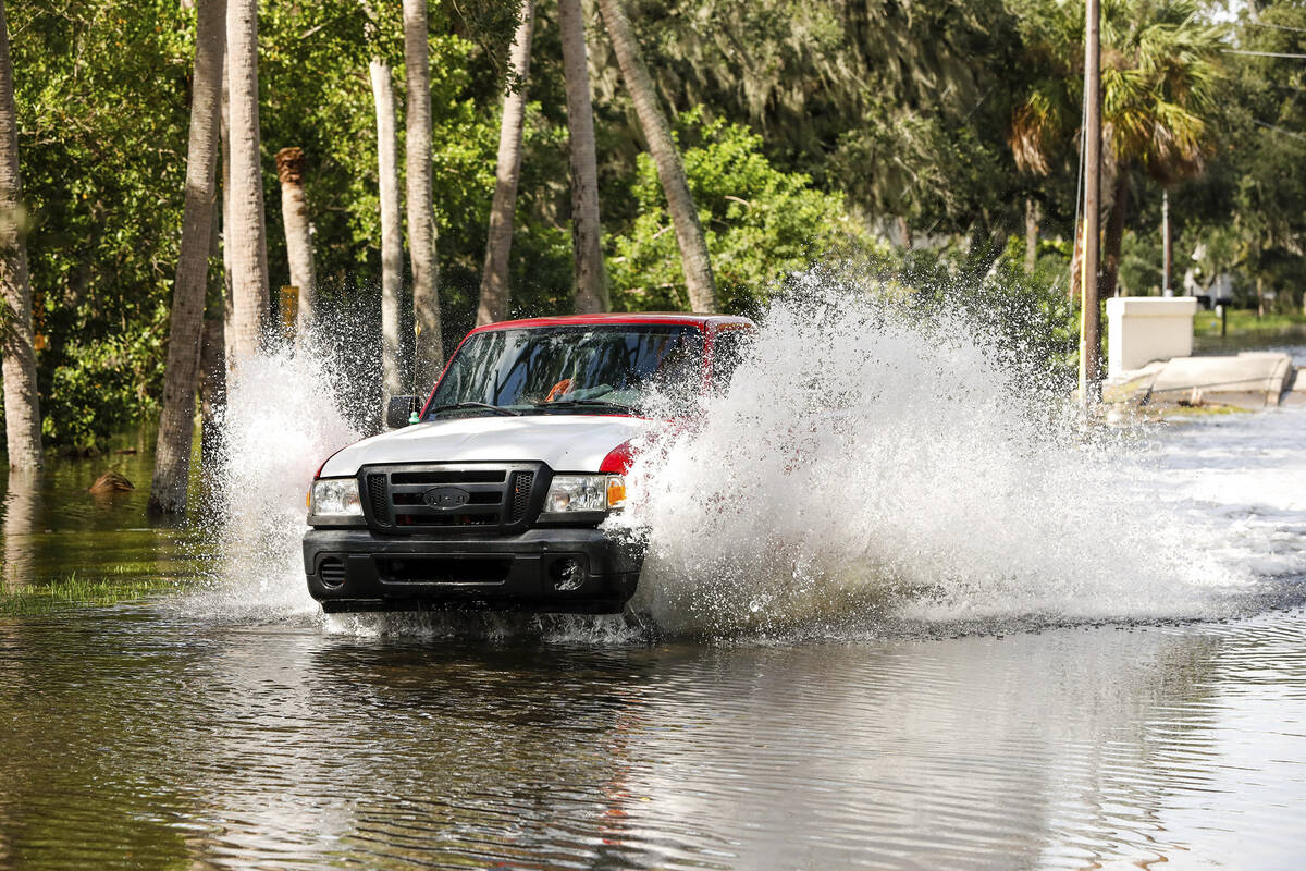 A truck drives through a flooded street around the Sunset Park neighborhood as Hurricane Helene ...