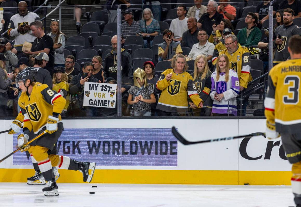 Fans line the glass as the Golden Knights and Los Angeles Kings warm up before the first period ...