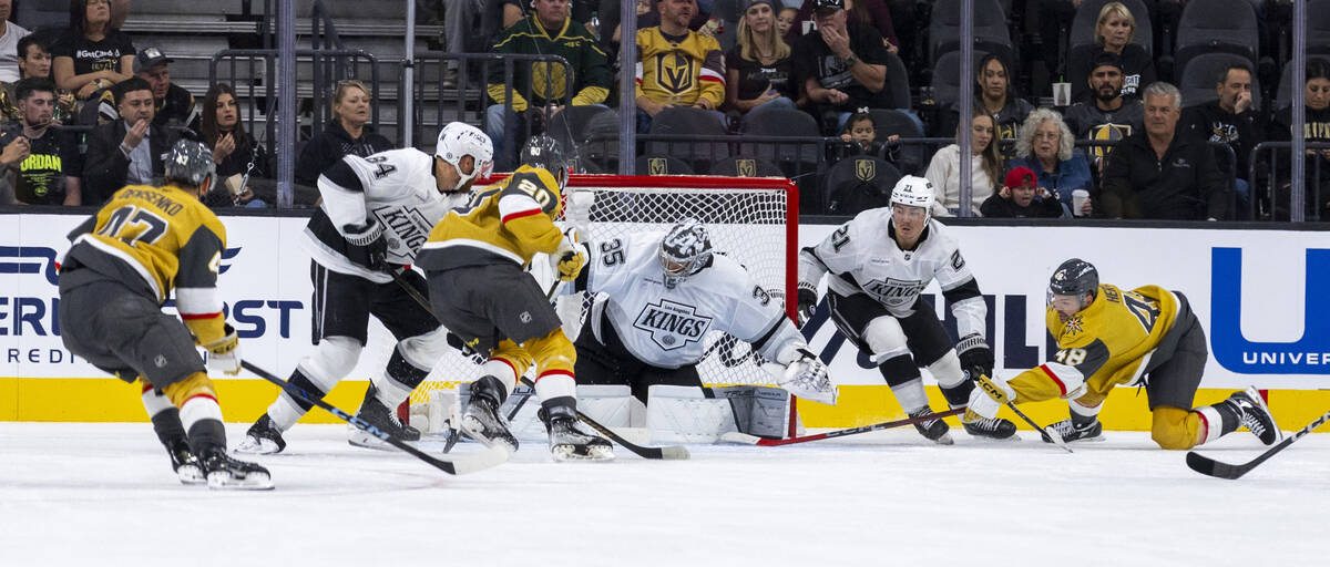 Golden Knights center Tomas Hertl (48) attempts to hook a shot in past Los Angeles Kings goalte ...