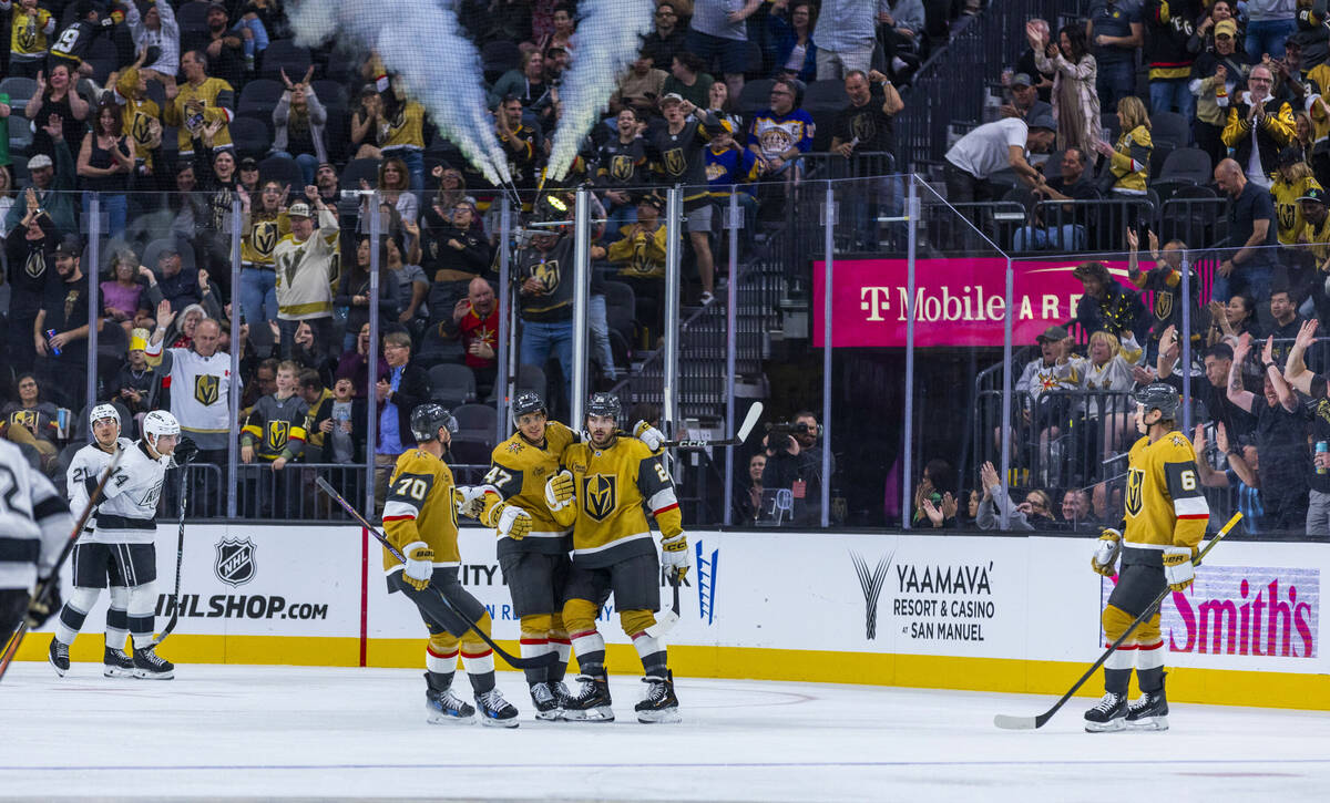 The Golden Knights celebrate a score against the Los Angeles Kings during the third period of t ...