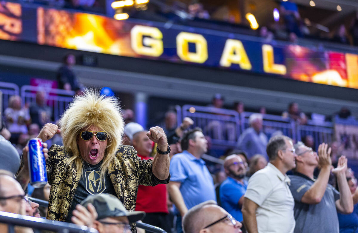 The Golden Knights fans celebrate a score against the Los Angeles Kings during the third period ...