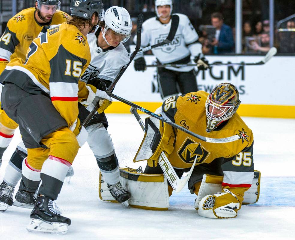 Golden Knights goaltender Ilya Samsonov (35) smothers a shot by Los Angeles Kings center Alex T ...