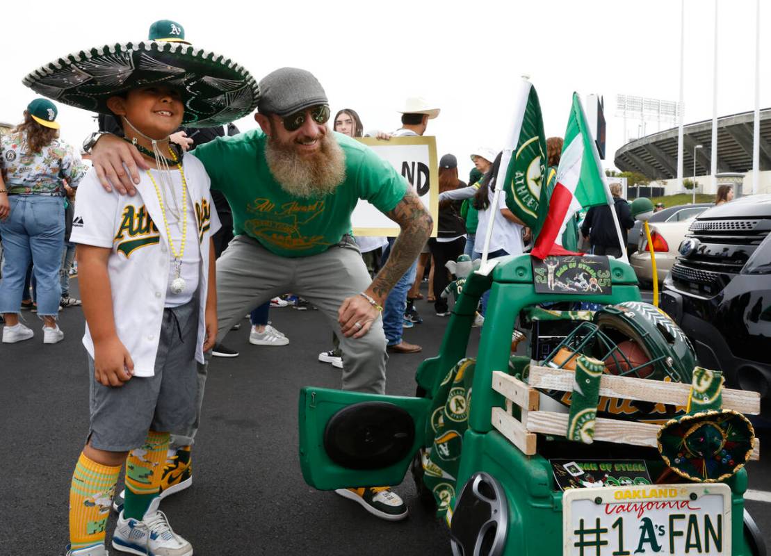 Former Oakland Athletics pitcher Dallas Braden poses for a photo with Cruz Munoz, 8, before Oak ...