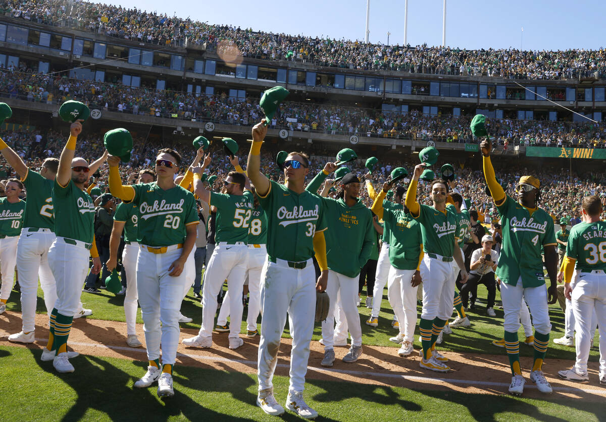 Oakland Athletics players acknowledge their fans after playing their final home game against th ...