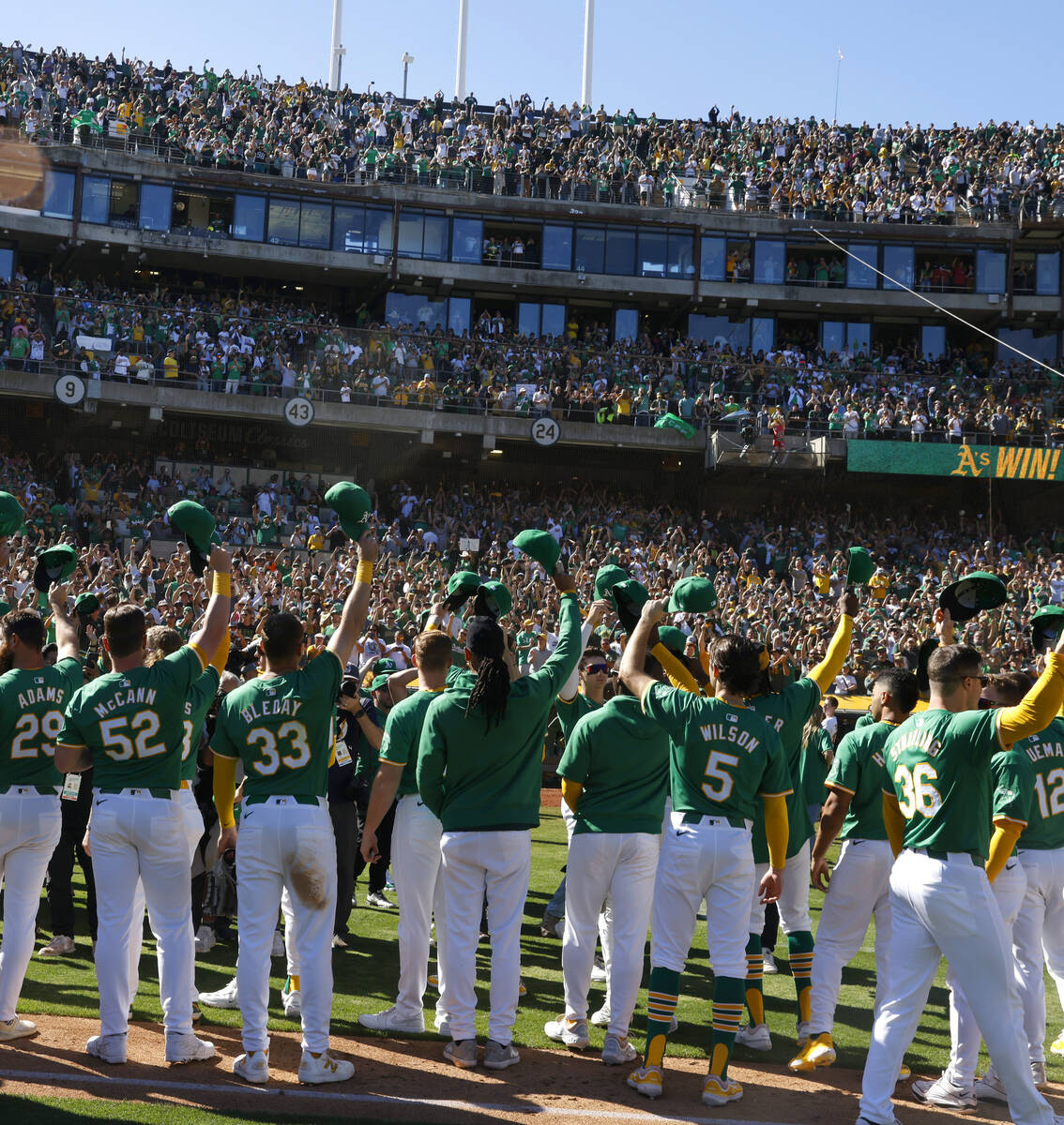 Oakland Athletics players acknowledge their fans after playing their final home game against th ...