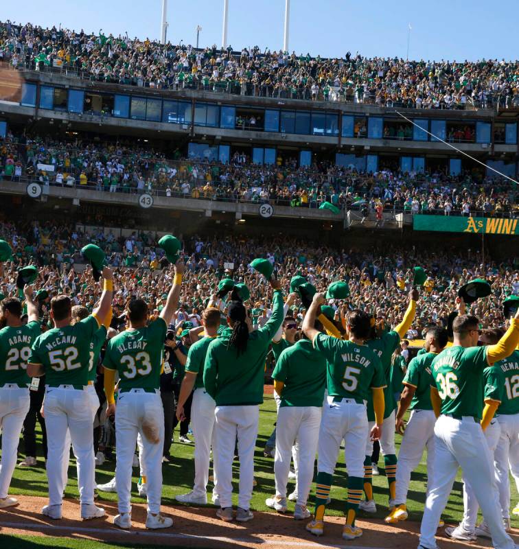 Oakland Athletics players acknowledge their fans after playing their final home game against th ...