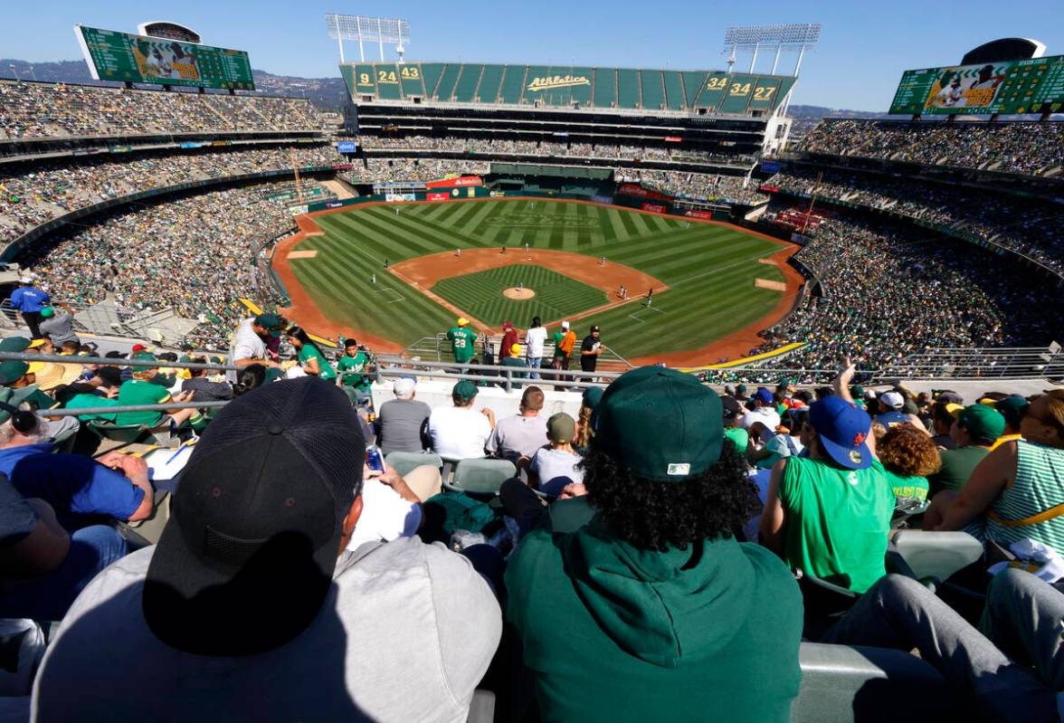 Fans watch Oakland Athletics final home game against the Texas Rangers at Oakland Coliseum, on ...