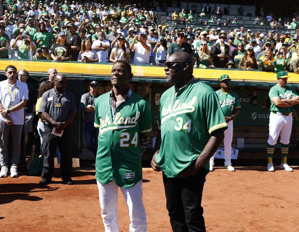 Oakland Athletics legends Rickey Henderson, left, and Dave Stewart chat before Oakland A's fina ...