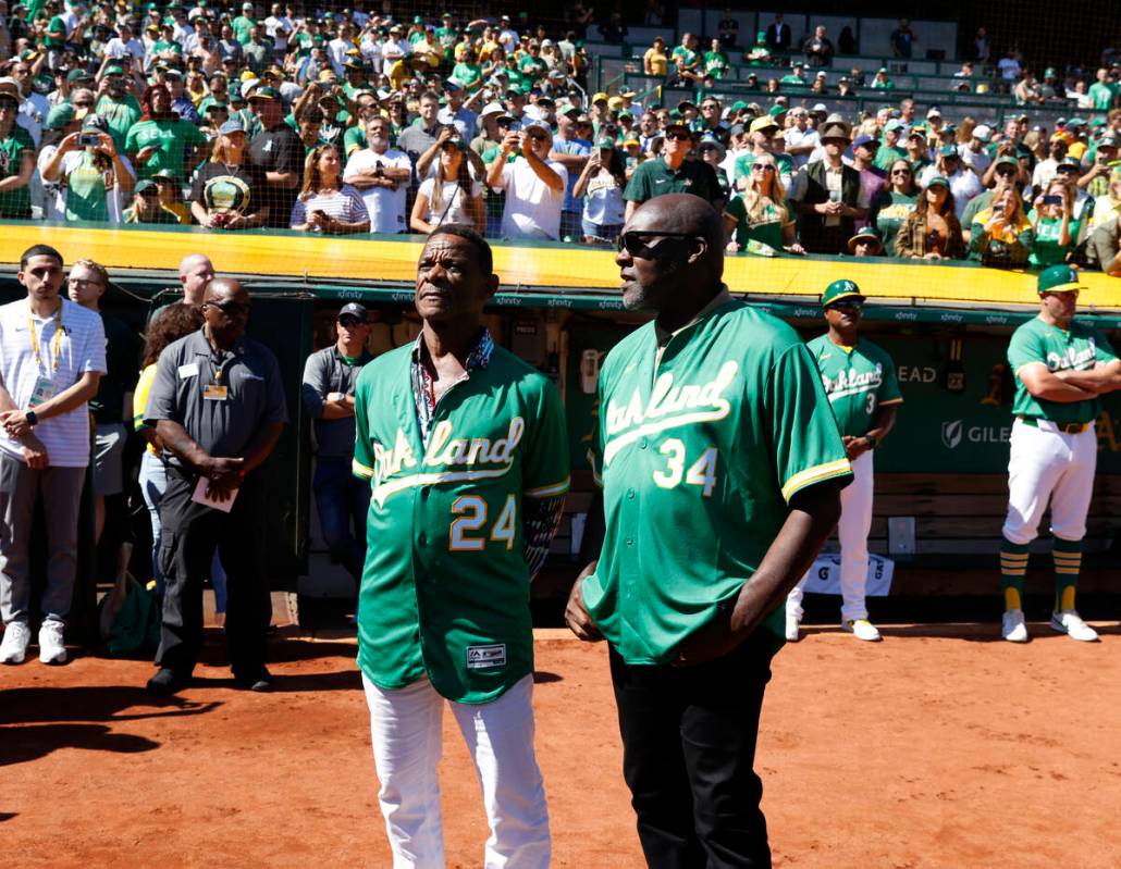 Oakland Athletics legends Rickey Henderson, left, and Dave Stewart chat before Oakland A's fina ...