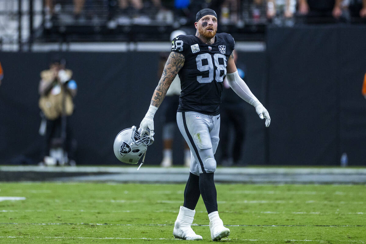 Raiders defensive end Maxx Crosby (98) walks off the field after another Carolina Panthers scor ...