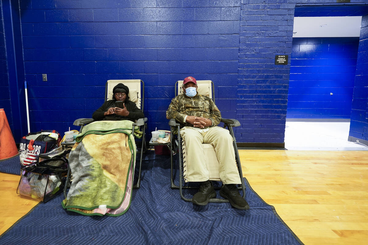 Mary Tanner Jerome Tanner, of Tallahassee, sit inside an evacuation shelter ahead of Hurricane ...