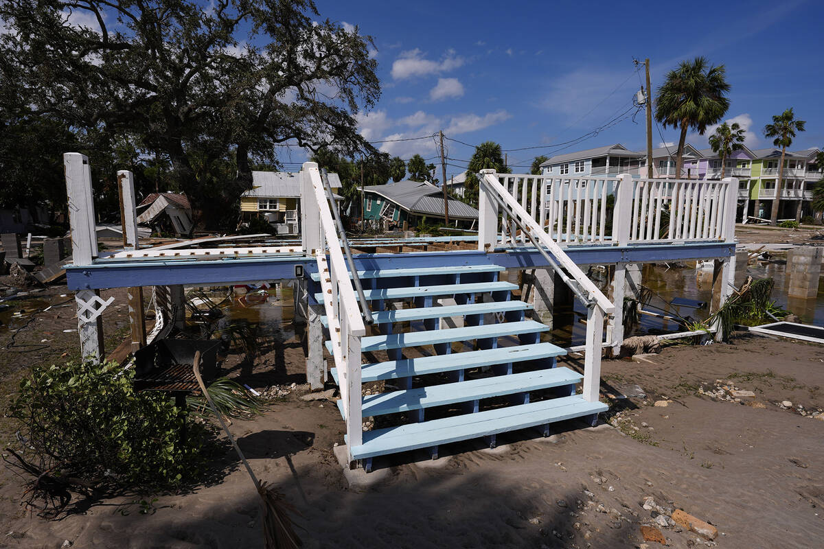 Steps remain at the foundation of a destroyed building in the aftermath of Hurricane Helene, in ...