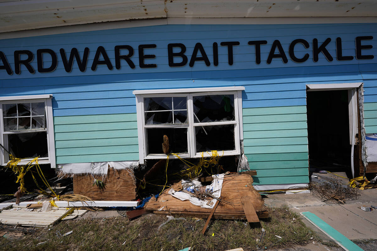 A destroyed bait shop is seen in the aftermath of Hurricane Helene, in Cedar Key, Fla., Friday, ...