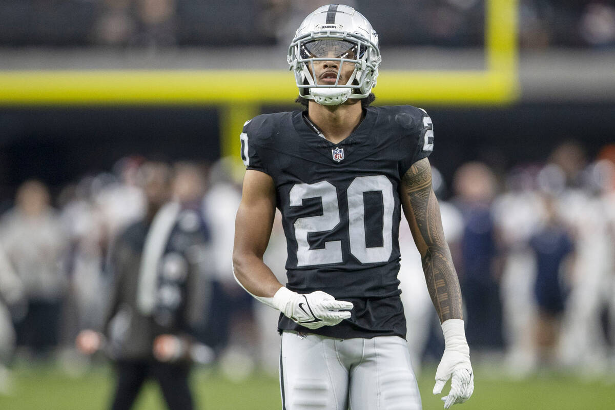 Raiders safety Isaiah Pola-Mao (20) warms up before an NFL game against the Denver Broncos at A ...