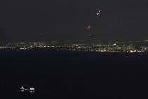 Israeli Iron Dome air defense system fires to intercept rockets that were launched from Lebanon ...