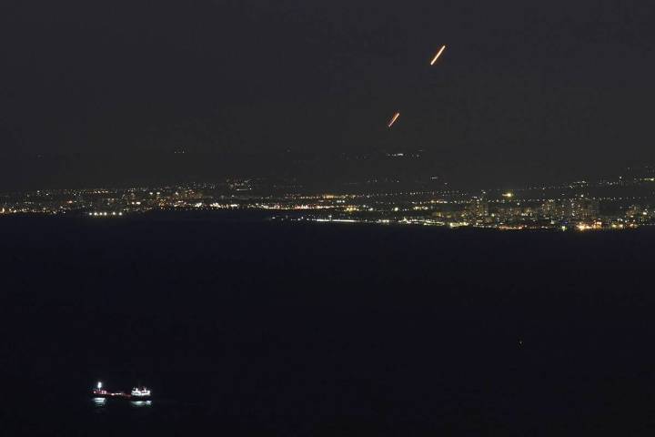 Israeli Iron Dome air defense system fires to intercept rockets that were launched from Lebanon ...