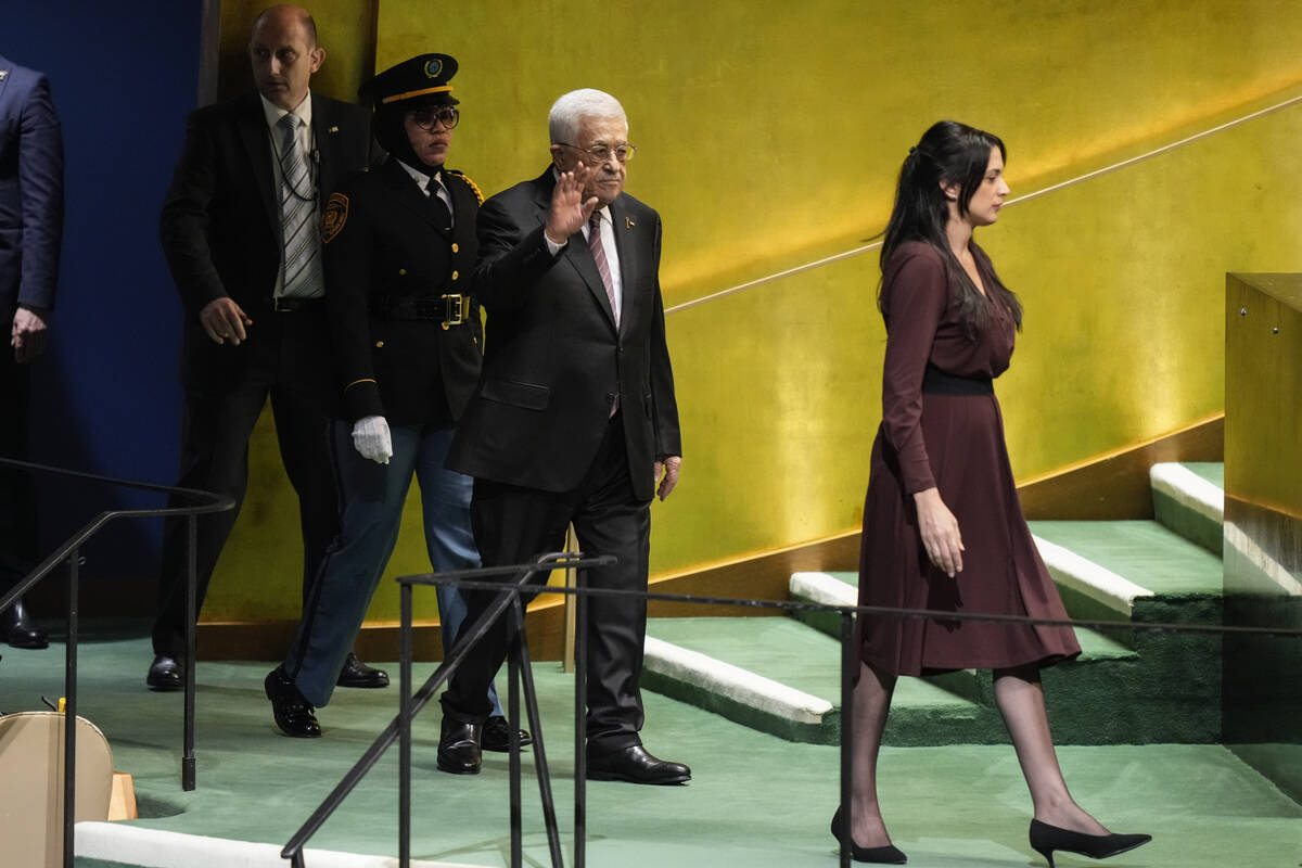 Palestinian President Mahmoud Abbas is escorted to the podium to address the 79th session of th ...