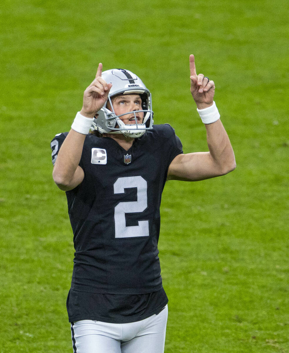 Raiders place kicker Daniel Carlson (2) thanks the heavens for another successful kick against ...