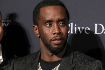 Sean Combs arrives at the Pre-Grammy Gala And Salute To Industry Icons at the Beverly Hilton Ho ...