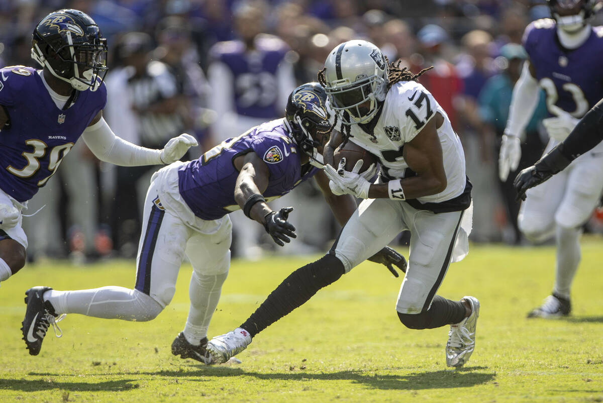 Baltimore Ravens cornerback Brandon Stephens (21) closes in to tackle Raiders wide receiver Dav ...