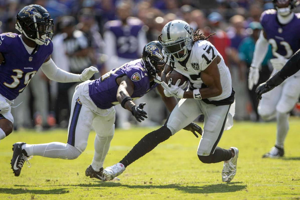 Baltimore Ravens cornerback Brandon Stephens (21) closes in to tackle Raiders wide receiver Dav ...