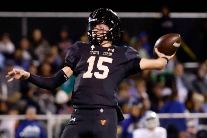 Faith Lutheran's quarterback Alex Rogers (15) throws a pass during the second half of a Class 5 ...