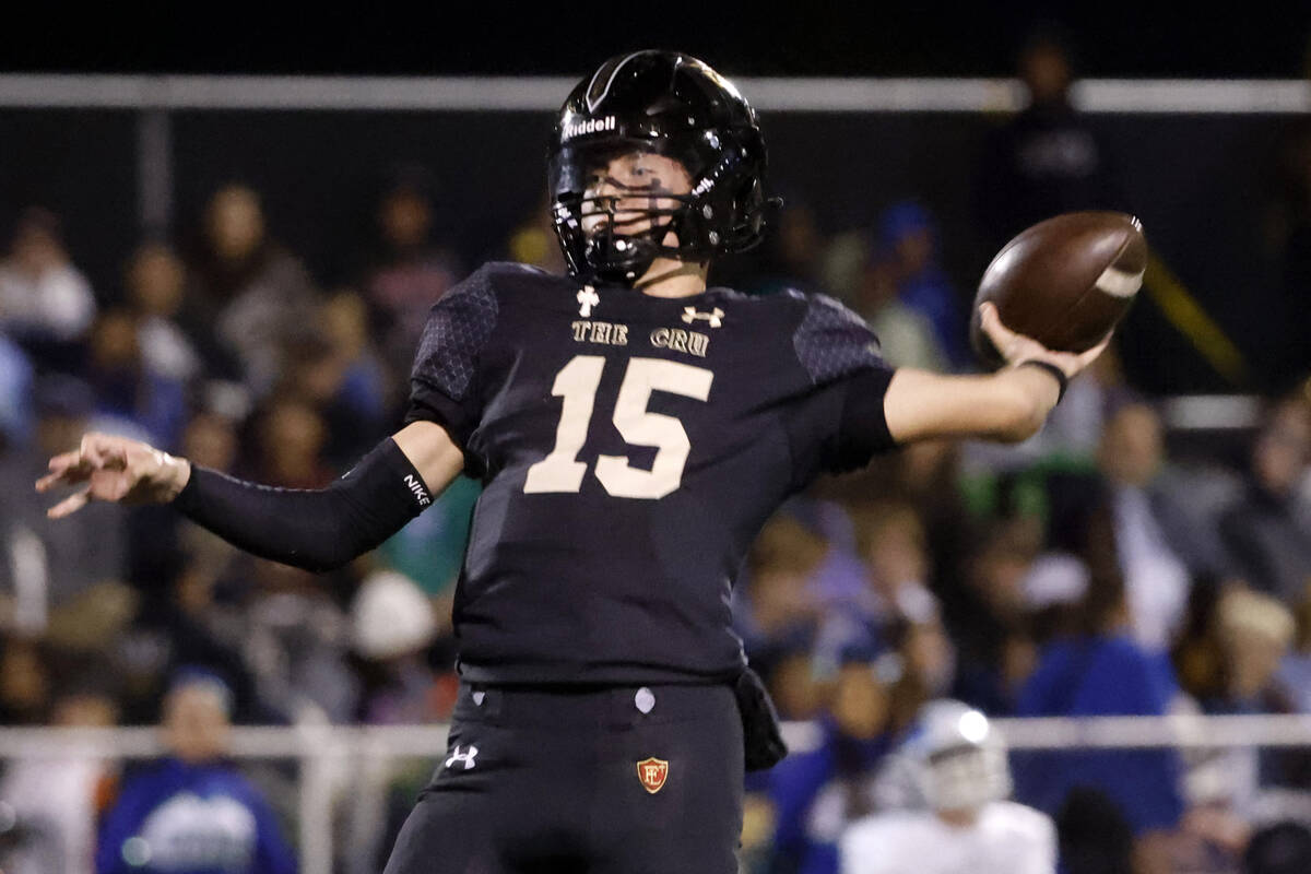 Faith Lutheran's quarterback Alex Rogers (15) throws a pass during the second half of a Class 5 ...