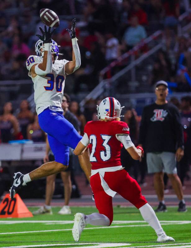 Bishop Gorman wide receiver Derek Meadows (30) leaps into the air in an attempt to catch a pass ...