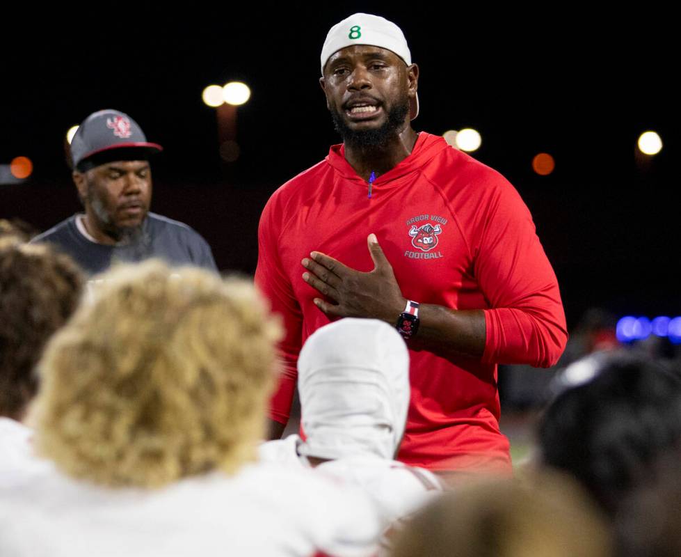 Arbor View Head Coach Marlon Barnett becomes emotional while talking to his football team after ...