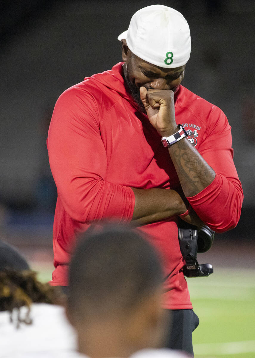 Arbor View Head Coach Marlon Barnett becomes emotional while talking to his football team after ...