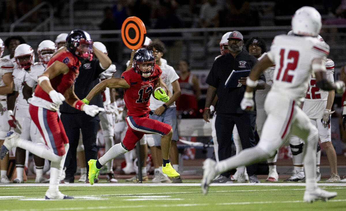 Coronado wide receiver Scott "Bubba" Holper (13) runs the ball during the high school ...