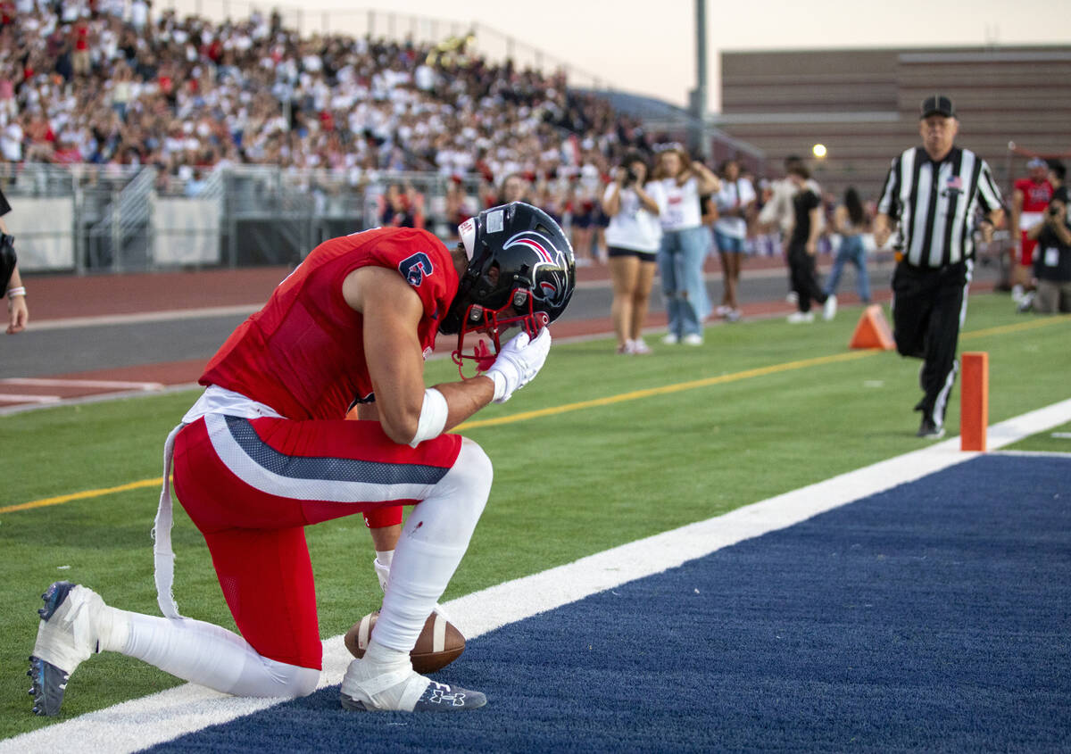 Coronado senior JJ Buchanan (6) kneels after scoring a touchdown during the high school footbal ...