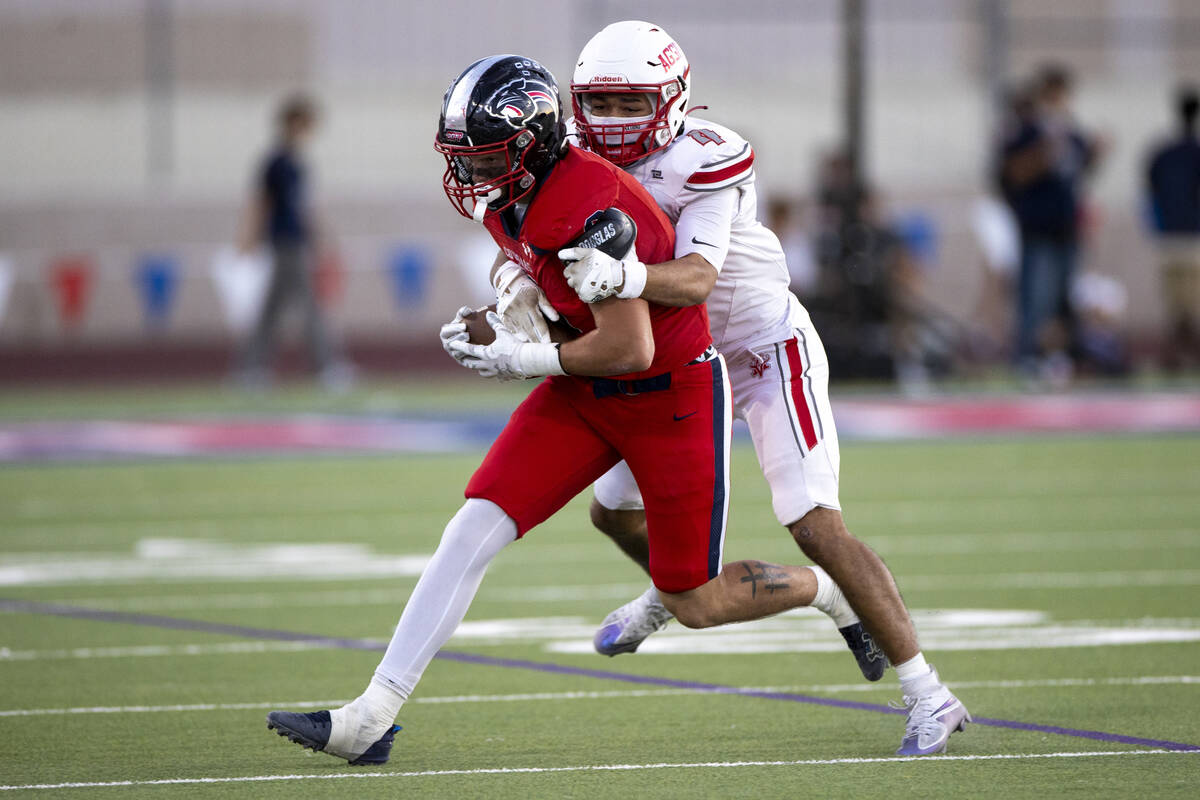 Arbor View senior Vicentico Pringle (4) attempts to tackle Coronado senior Neville Roberts (8) ...